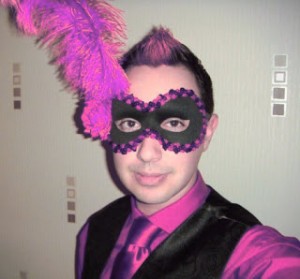 Teenage guy wearing a black and purple mask