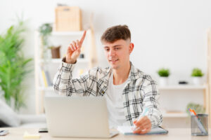 Student asking permission to talk during an online class from home